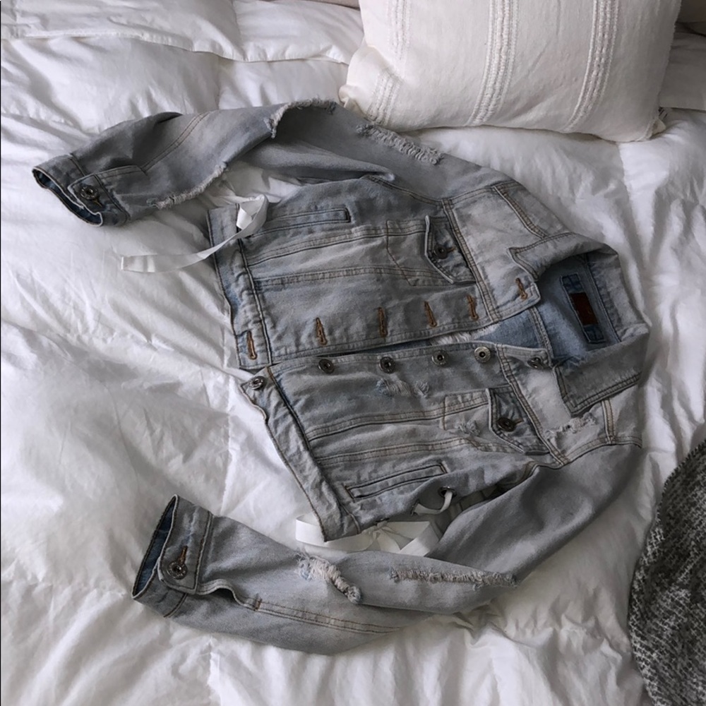 Distressed denim jacket. From boutique